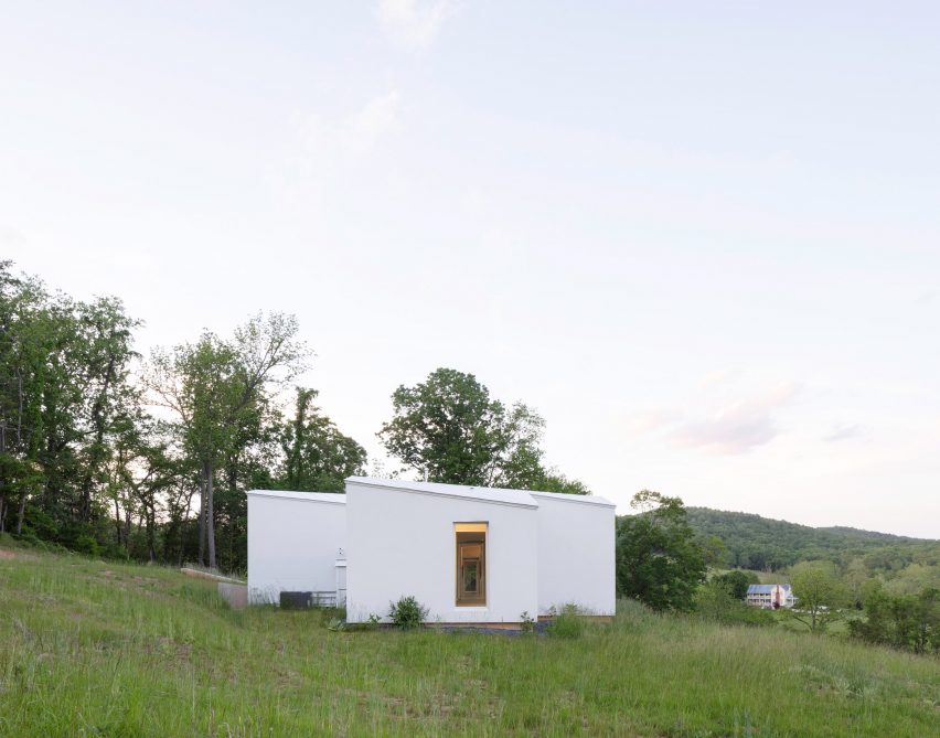 A white house in a meadow