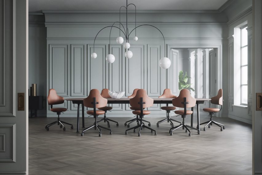 Conference room with boardroom table surrounded Spine chairs