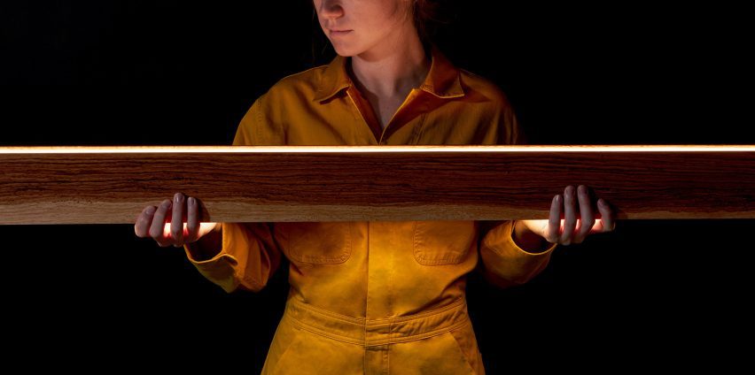 Woman holding linear lighting design