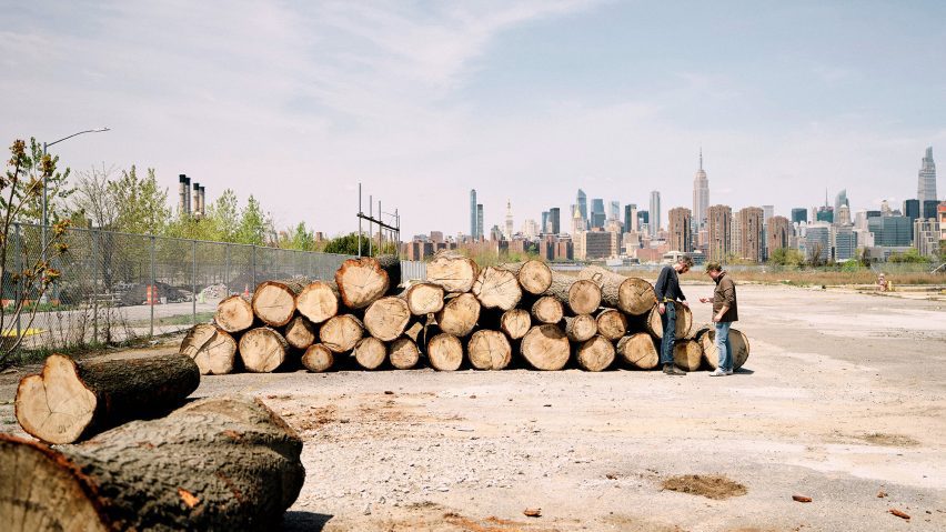 Wood in lumber yard with New York City Skyline