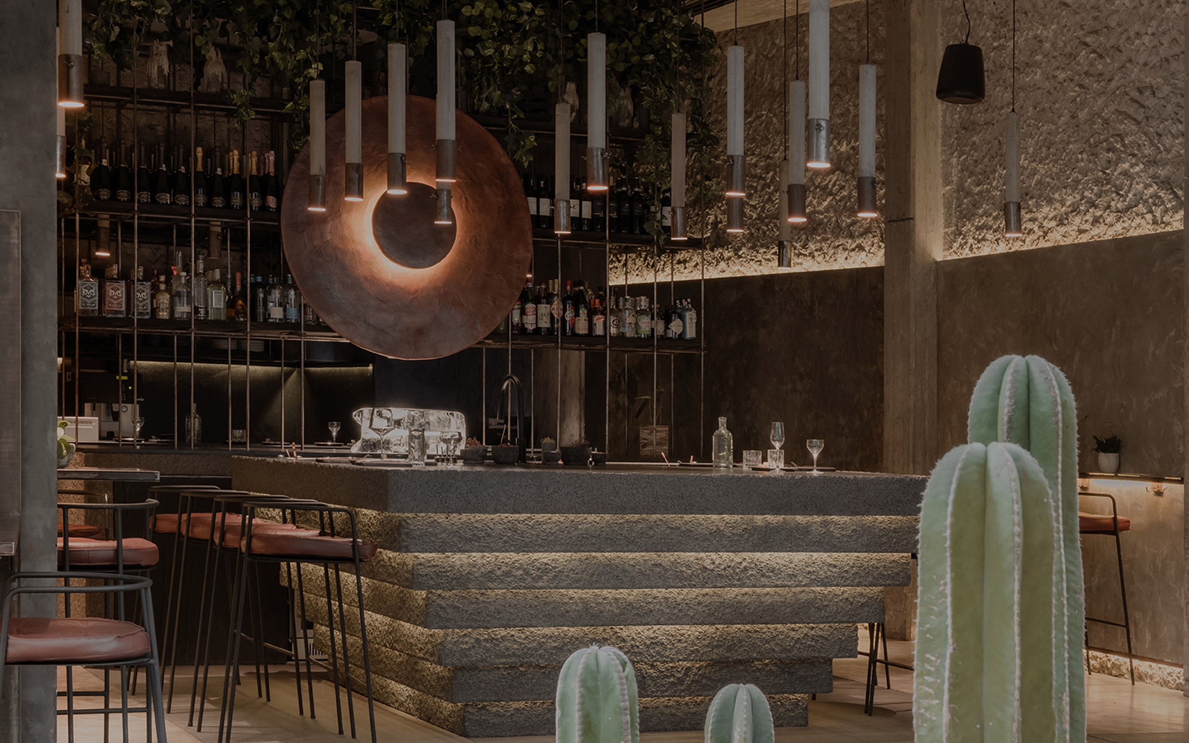 Tapas restaurant with concrete walls and central bar counter