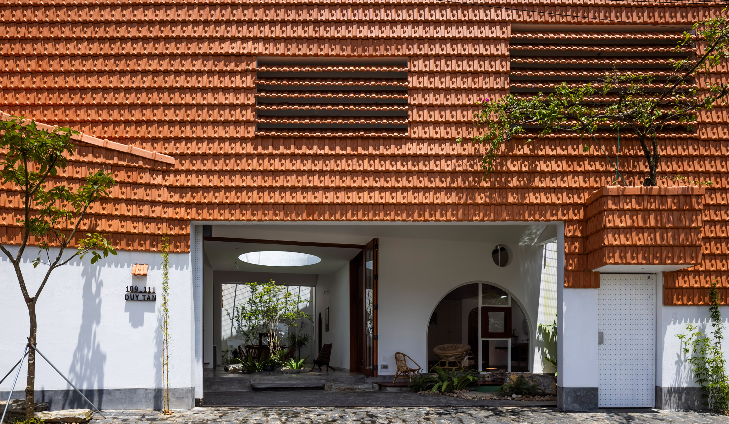 Red-tiled Tile House by The Bloom Architects