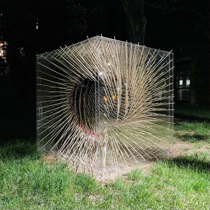 Photographs showing a sculptural form made from a transparent cube with matches inside it