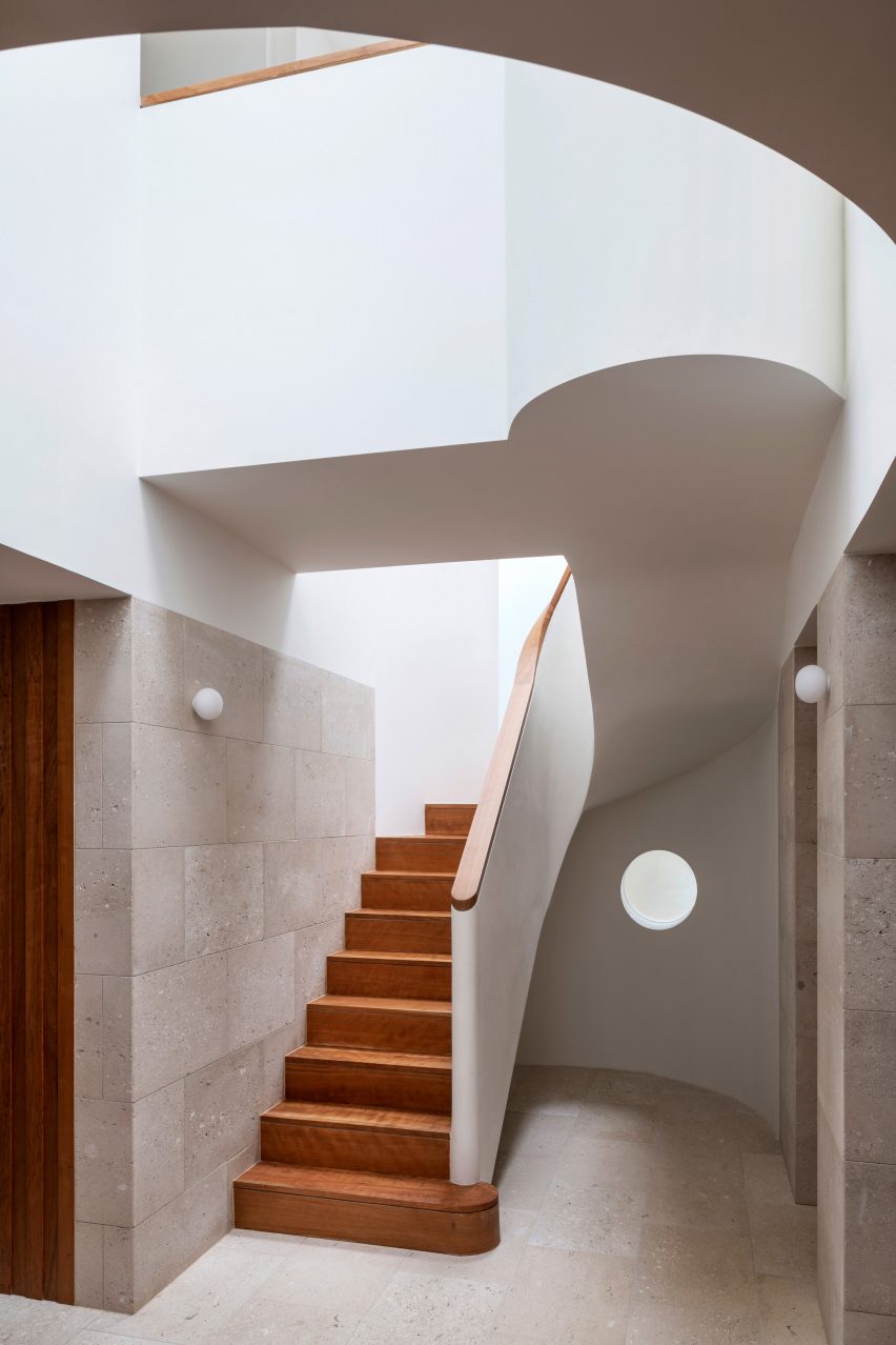 Double-height hallway and staircase in Wimbledon Villa, London