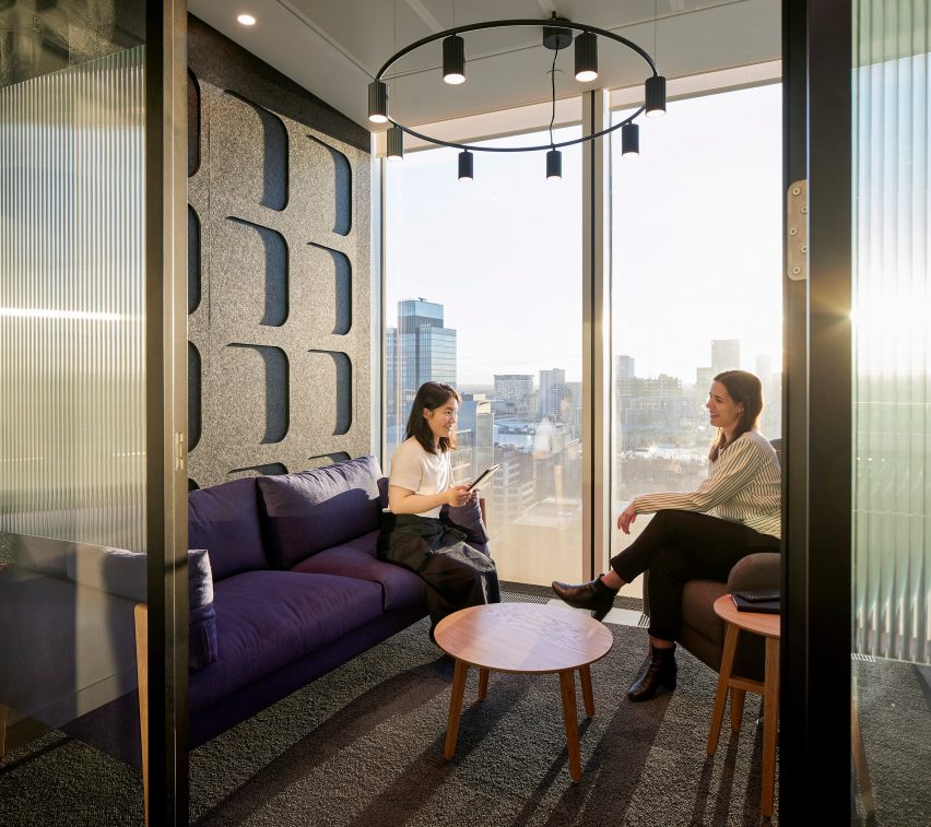 Acoustic panels in an office space with a city view