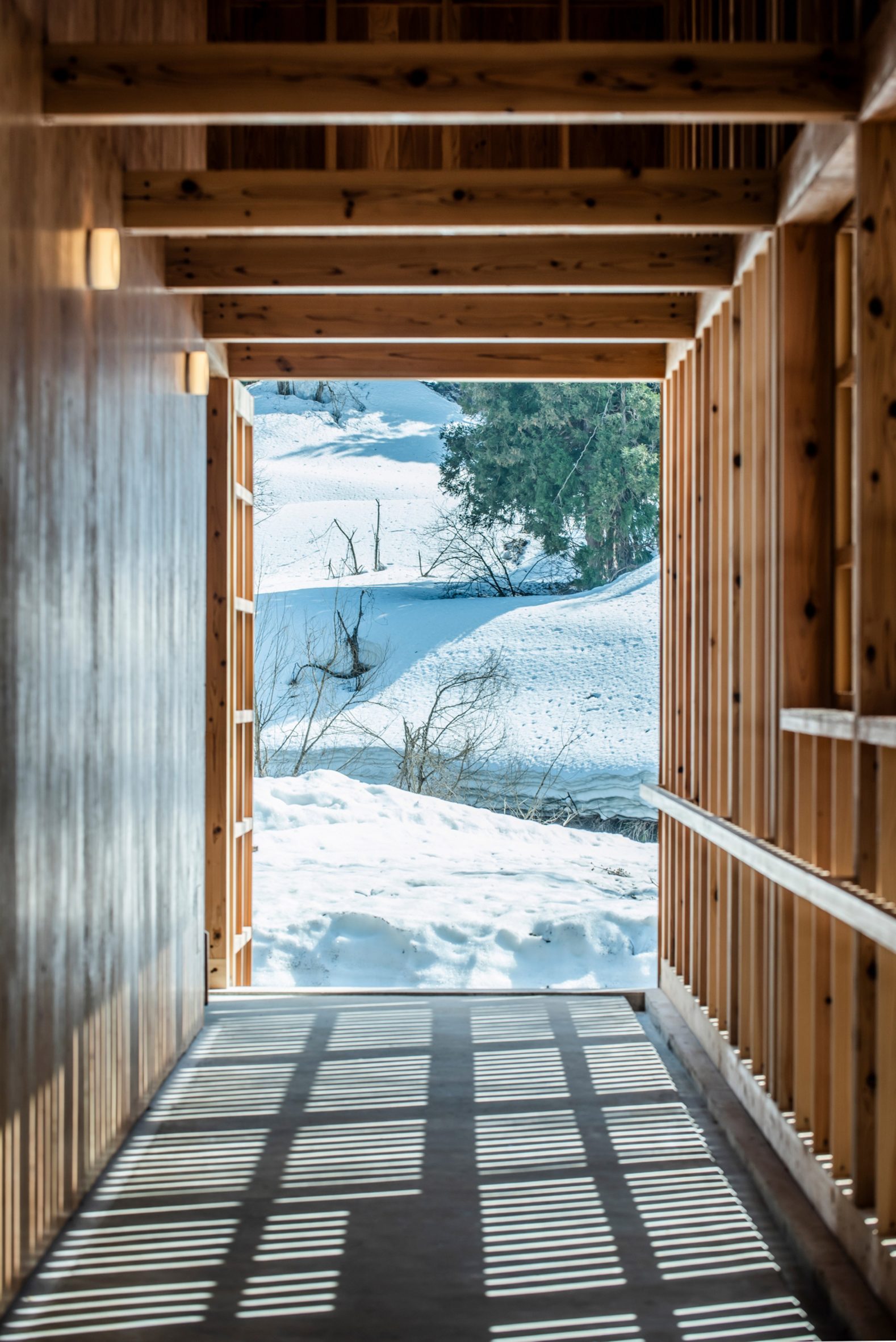 Timber-framed walkway in warehouse by Kei Kaihoh Architects in Joetsu City, Niigata Prefecture