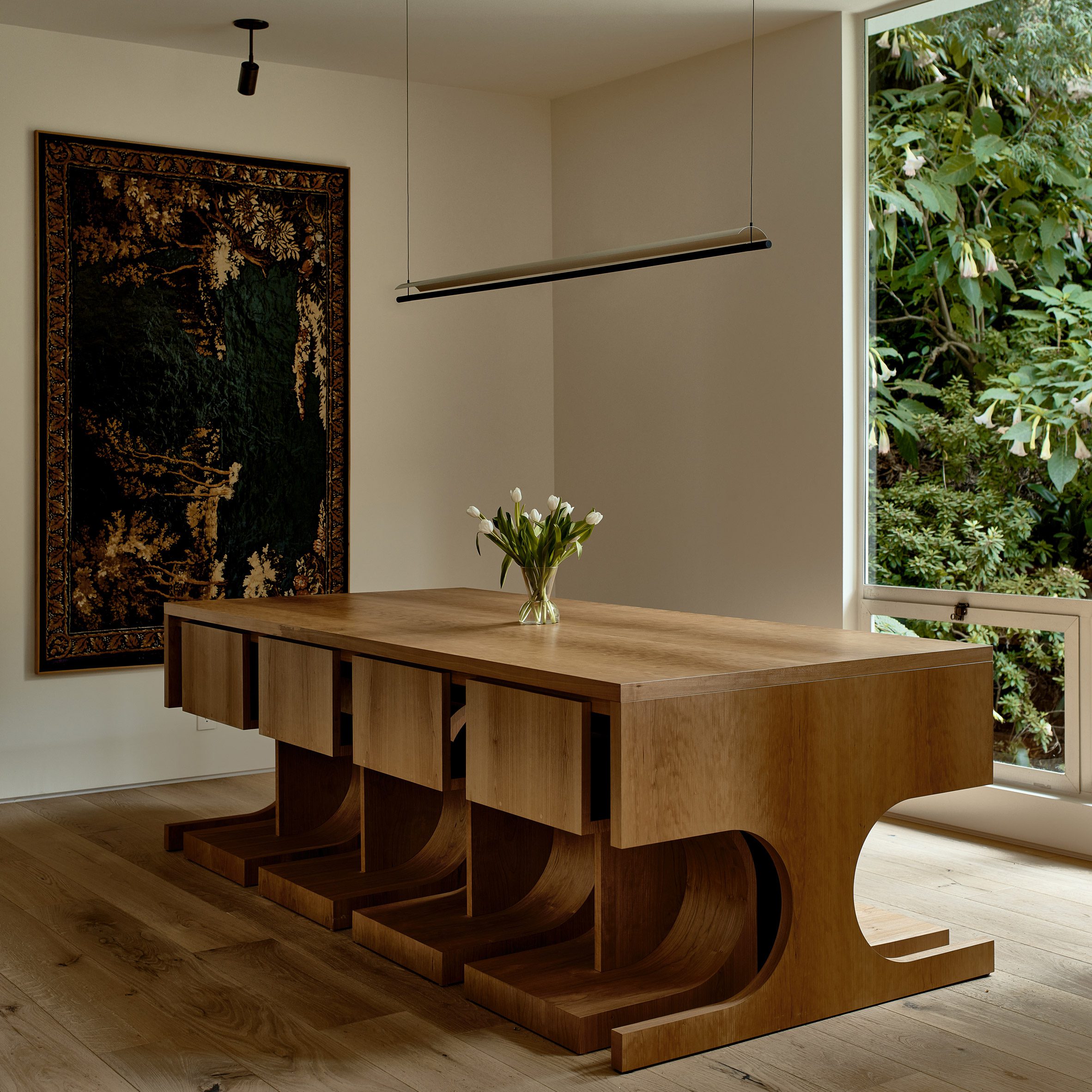 Wood dining table with chairs that tuck neatly underneath
