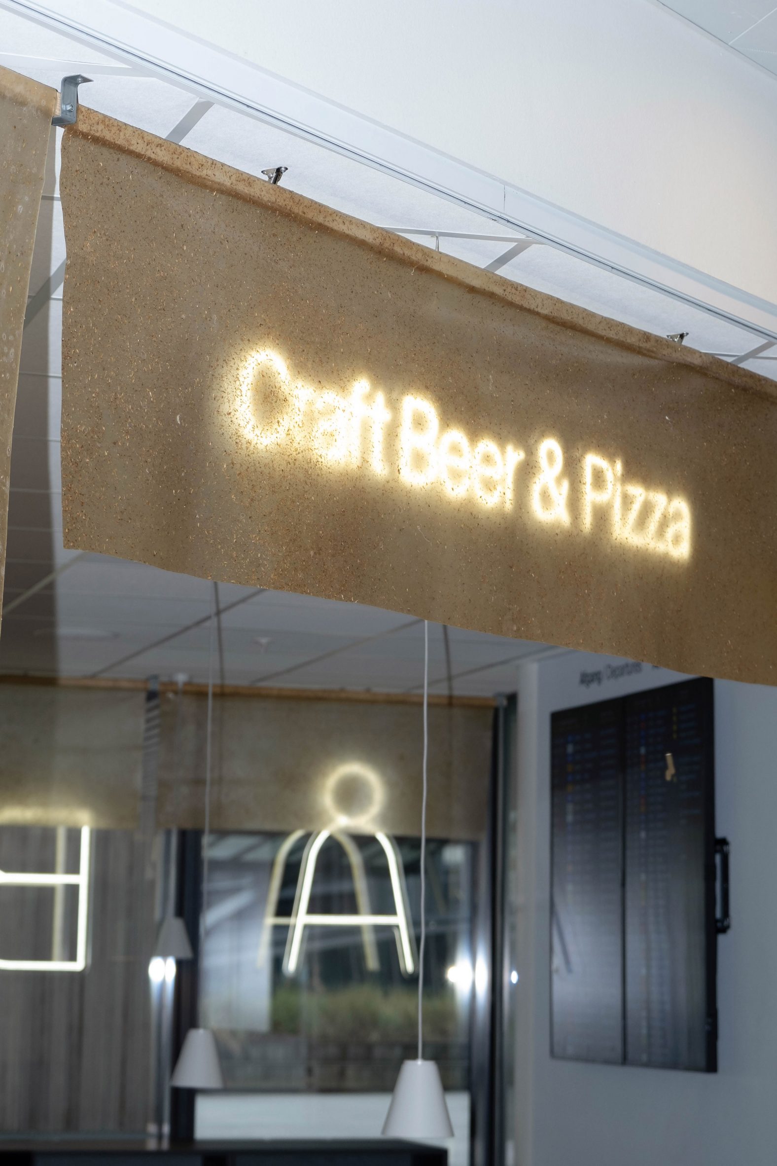 Beer-based panels illuminated with a craft beer sign