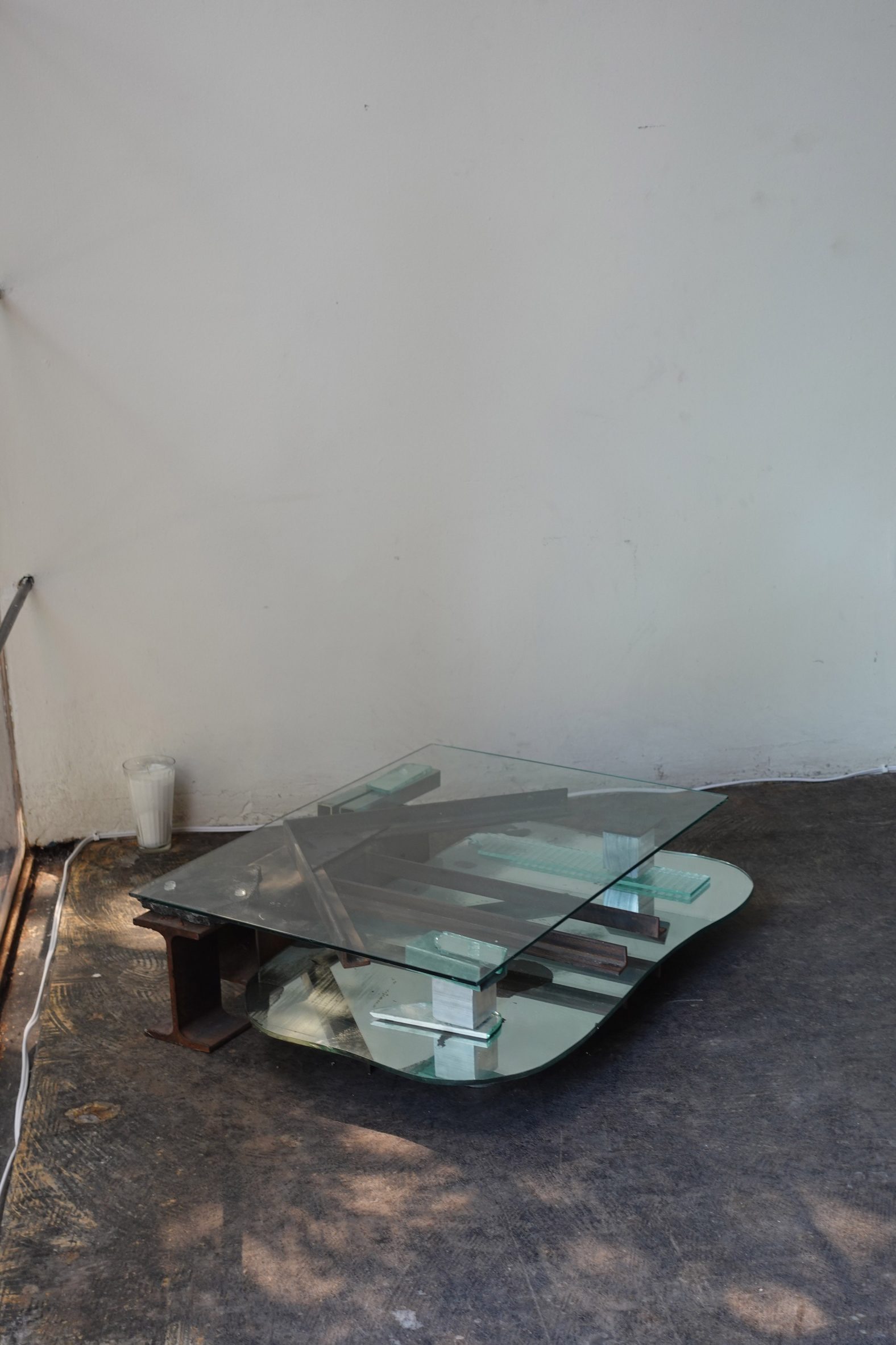 Coffee table made of reclaimed steel and glass