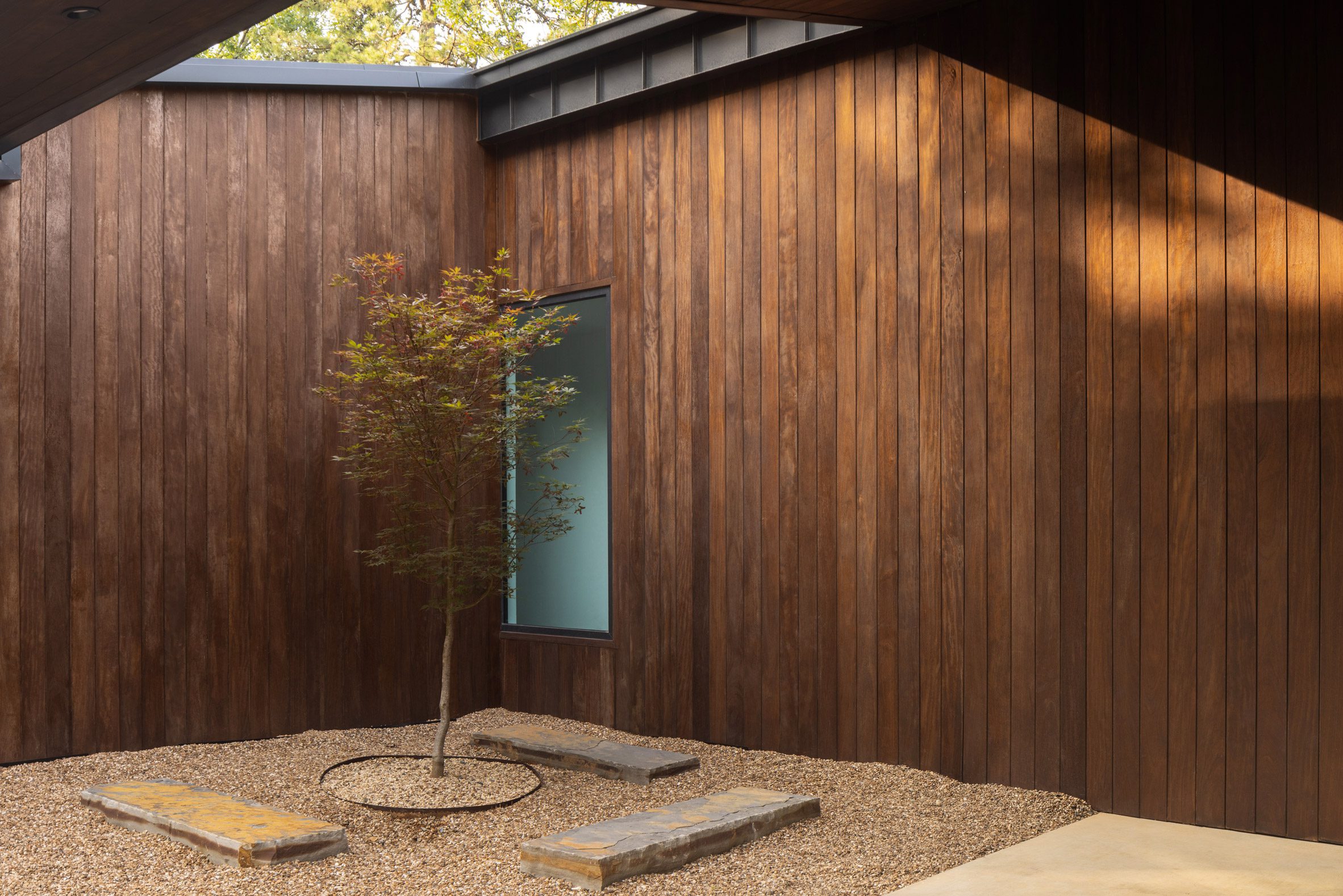 Courtyard and void in Oklahoma cabin by Far + Dang