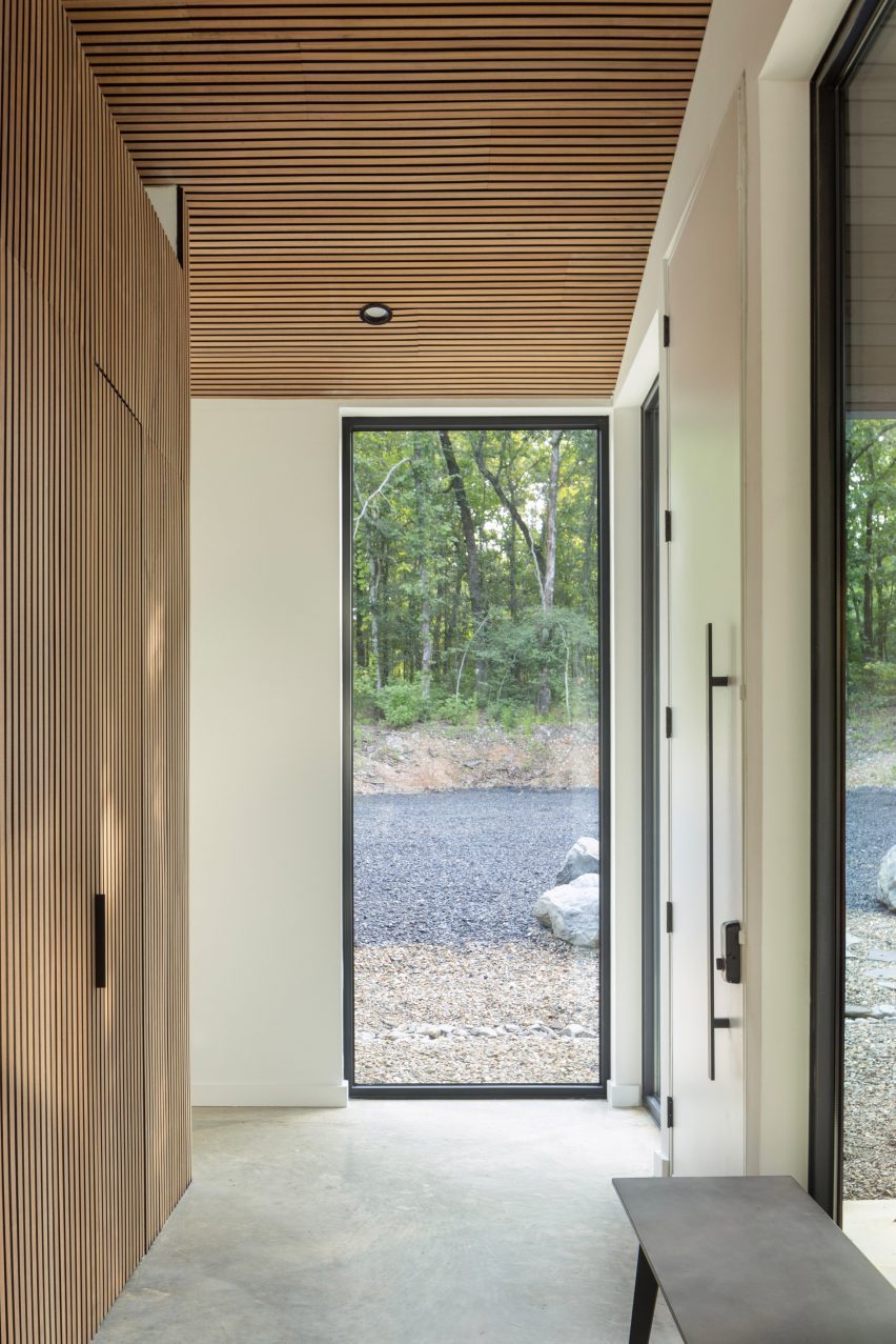 Window and walnut finishes in Oklahoma cabin by Far + Dang