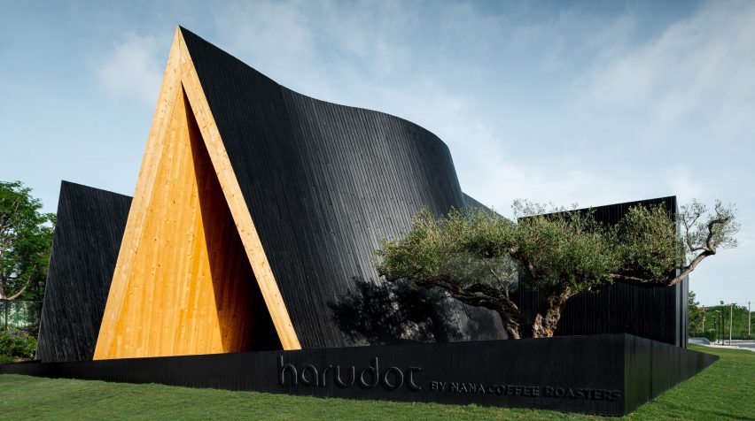 Blackened-wood exterior of Harudot cafe by IDIN Architects