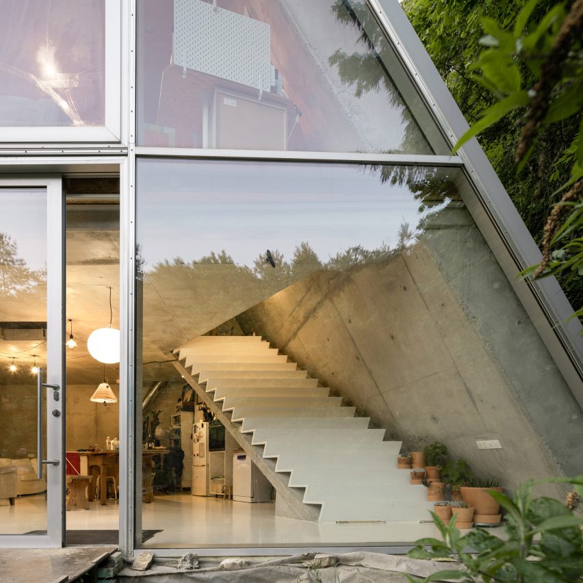 Trapezoidal concrete and glass house
