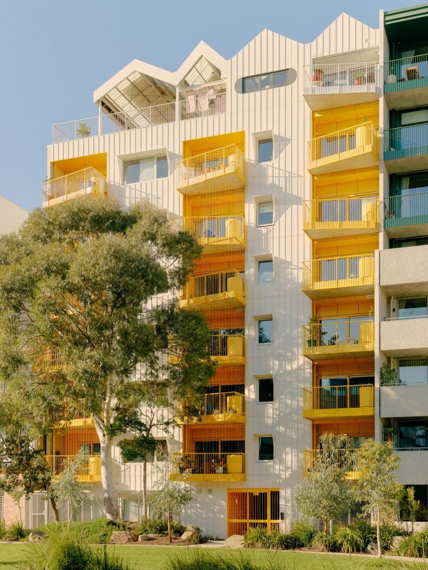 Exterior and yellow balconies of ParkLife apartment block in Melbourne by Austin Maynard Architects