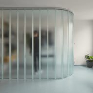 Neuhäusl Hunal renovate apartment in Prague using curved glass walls