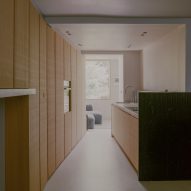 Kitchen with concrete flooring and wood wall cupboards