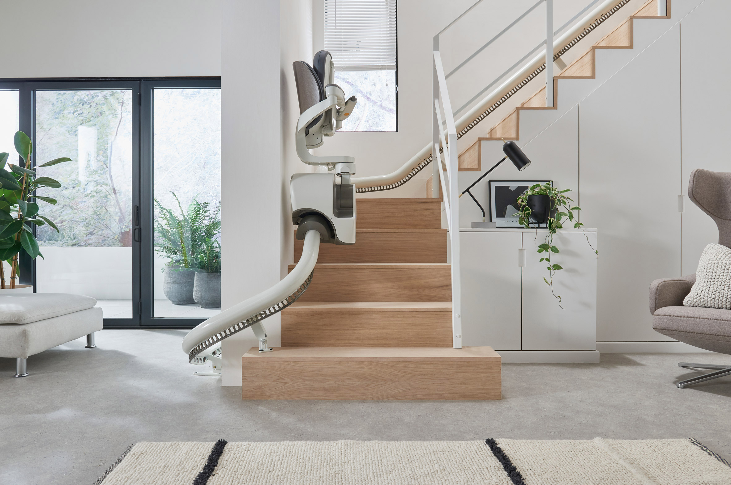 Flow X stairlift installed in a contemporary residential interior