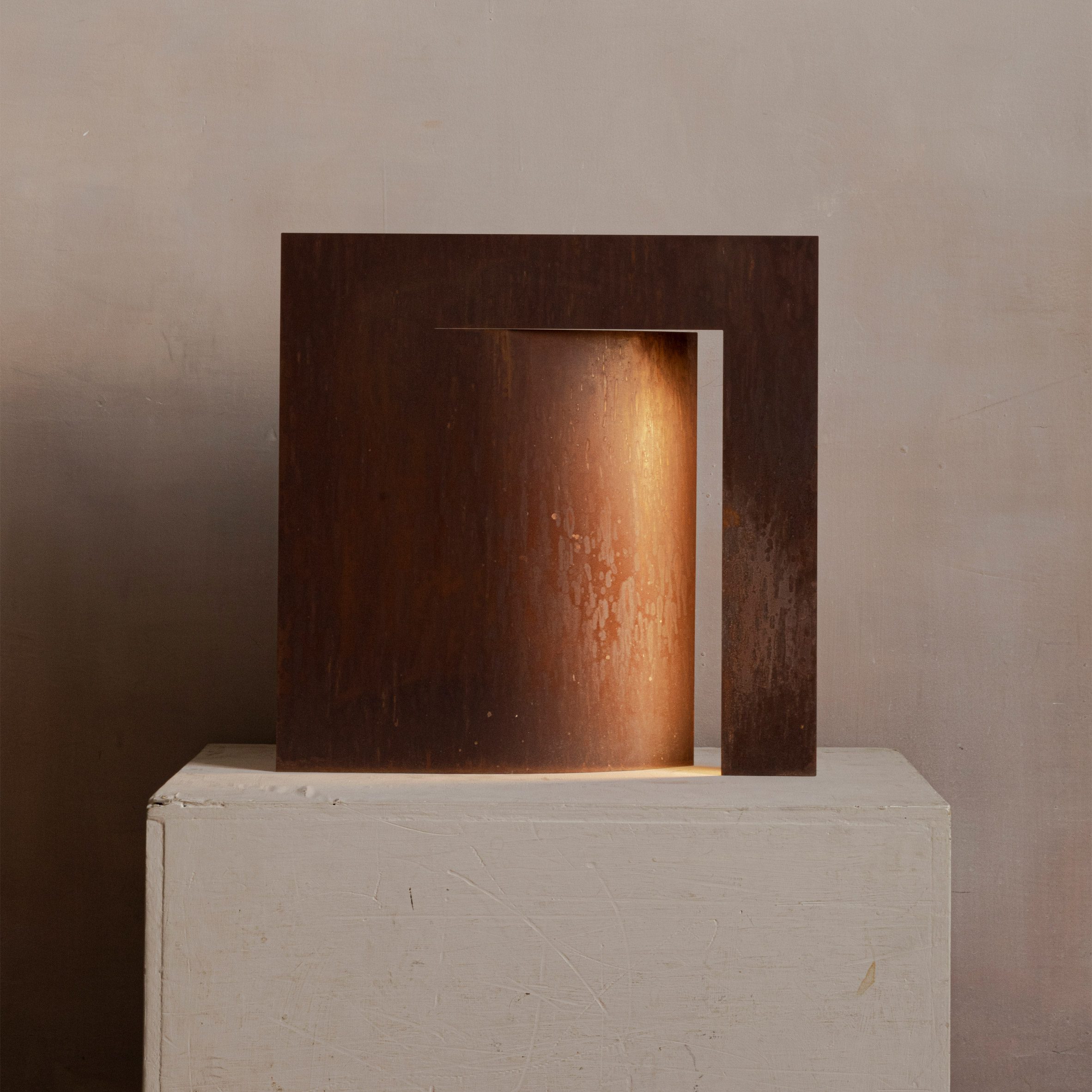 Manu Bañó designs lamp using a sheet of oxidised steel