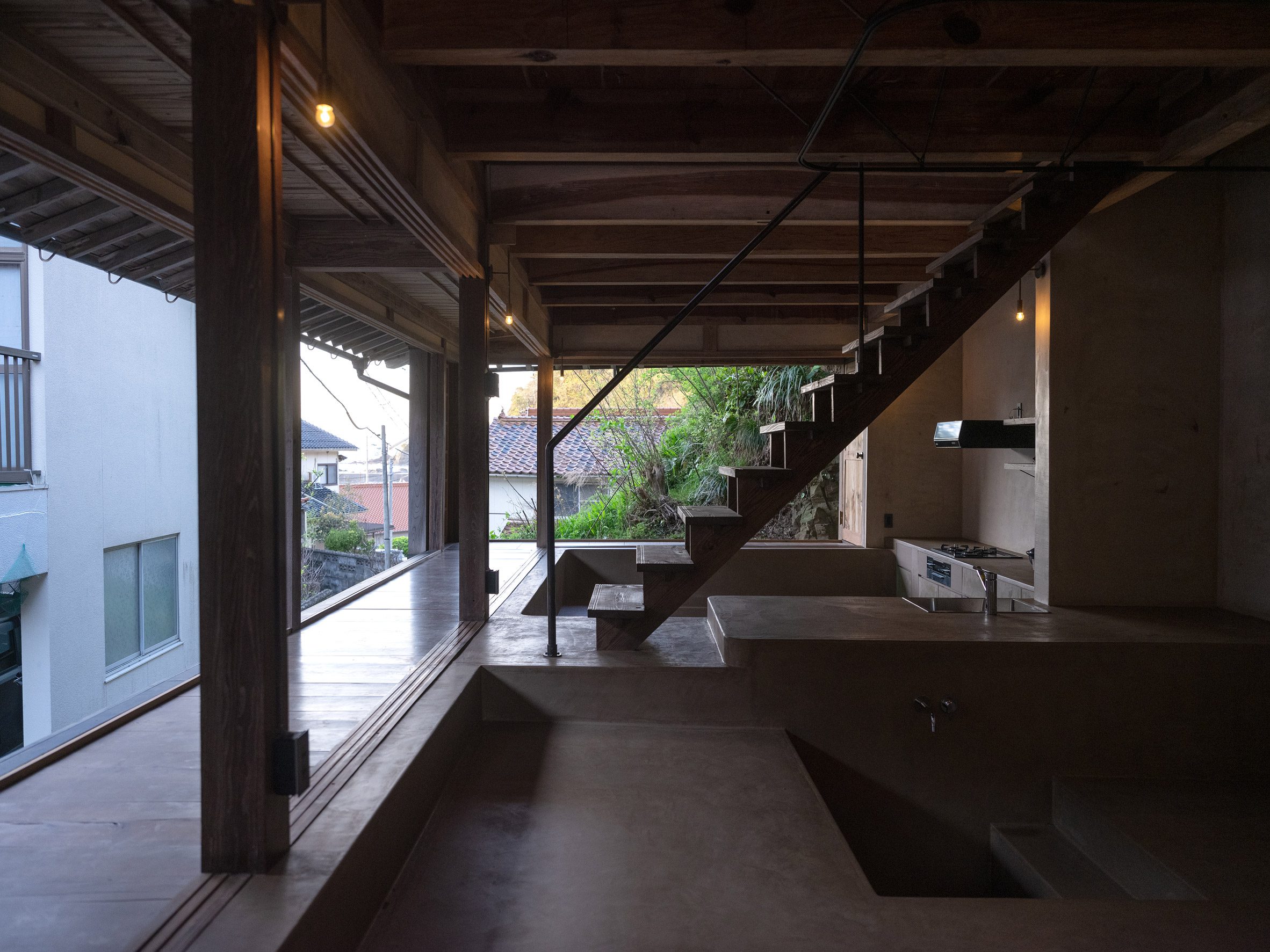 Sunken bathing ares in renovated minimalist home in Misumi, Japan by Studio AMB