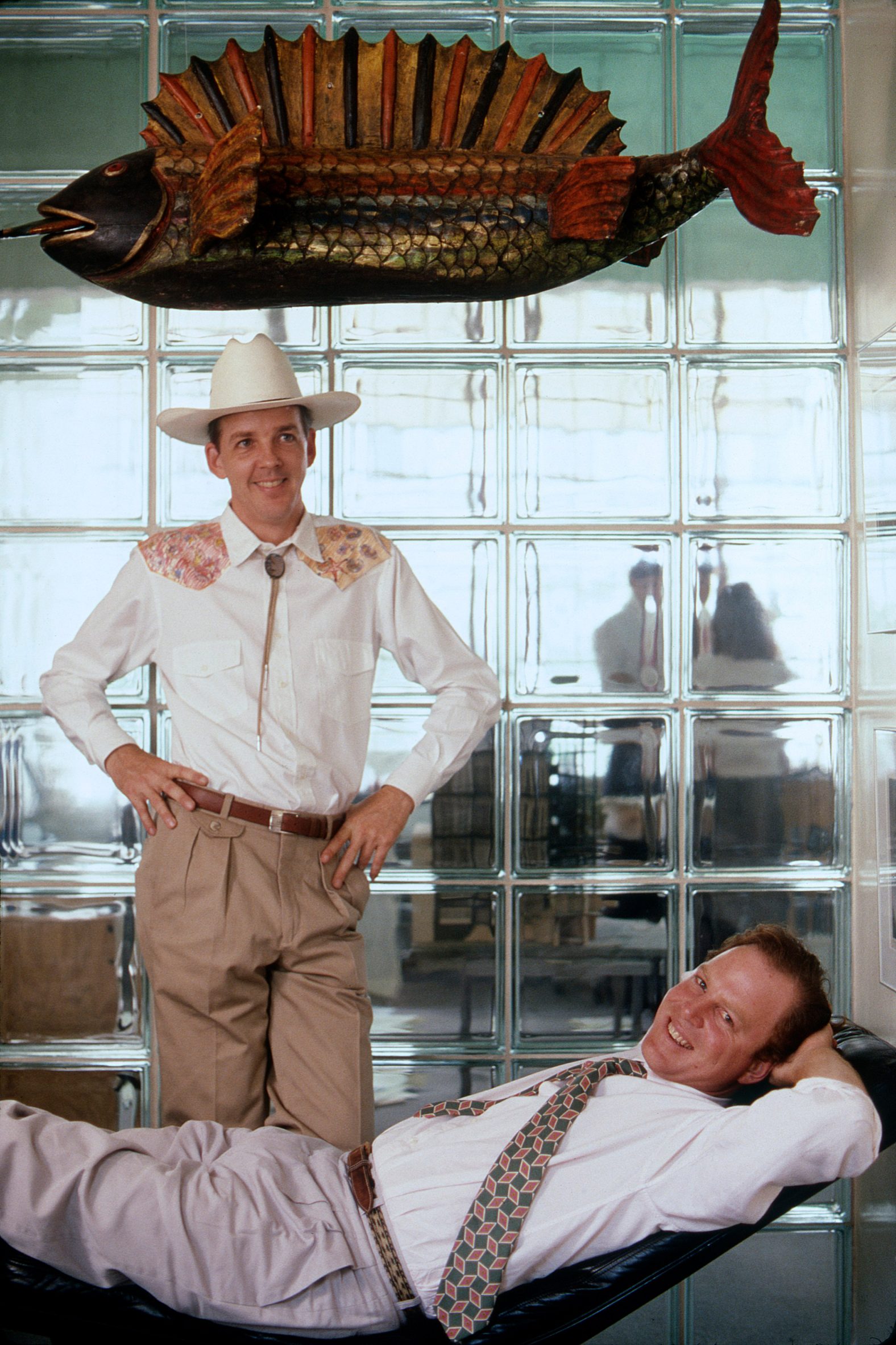 Historical photo of David Lake in cowboy hat with Ted Flato laying down