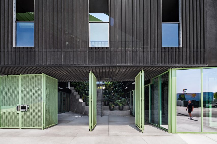 Green metal entry to courtyard