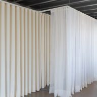 white curtains hanging from a metallic ceiling