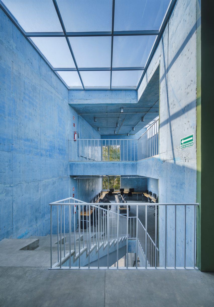 Blue concrete walls and a geometric skylight