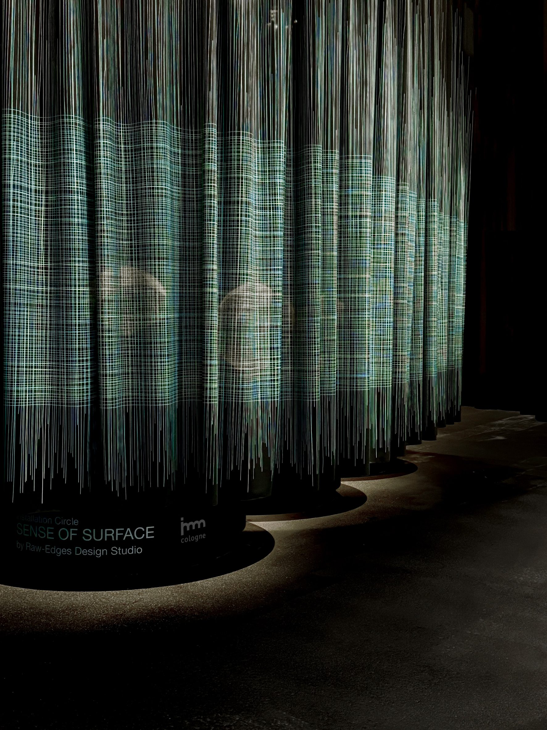 Curtain as part of the Sense of Surface installation featuring black and green patterns