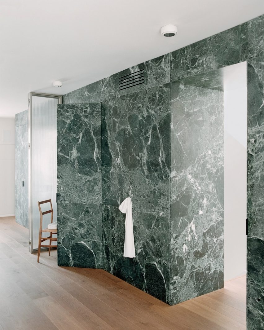 View of marble par،ion in Green Nest Apartment by AIM Studio in Milan