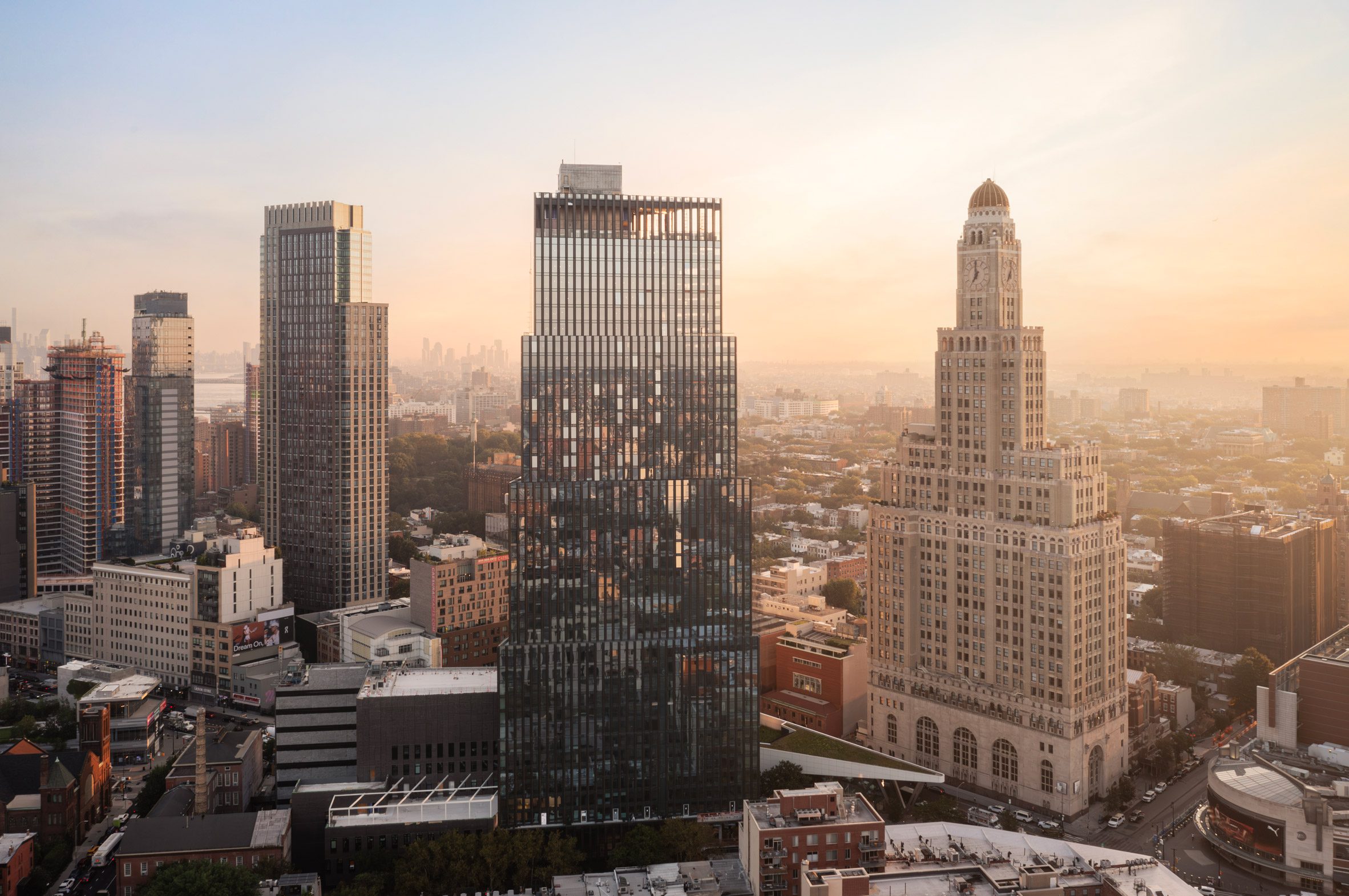Flat Iron-like skyscraper by Alloy nears completion in Brooklyn