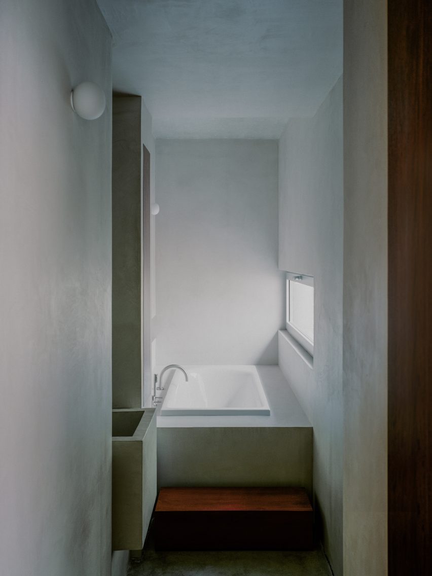 Concrete bathroom interior at rural home in France by Alors Studio