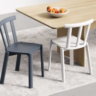 Grey and white dining chairs by table