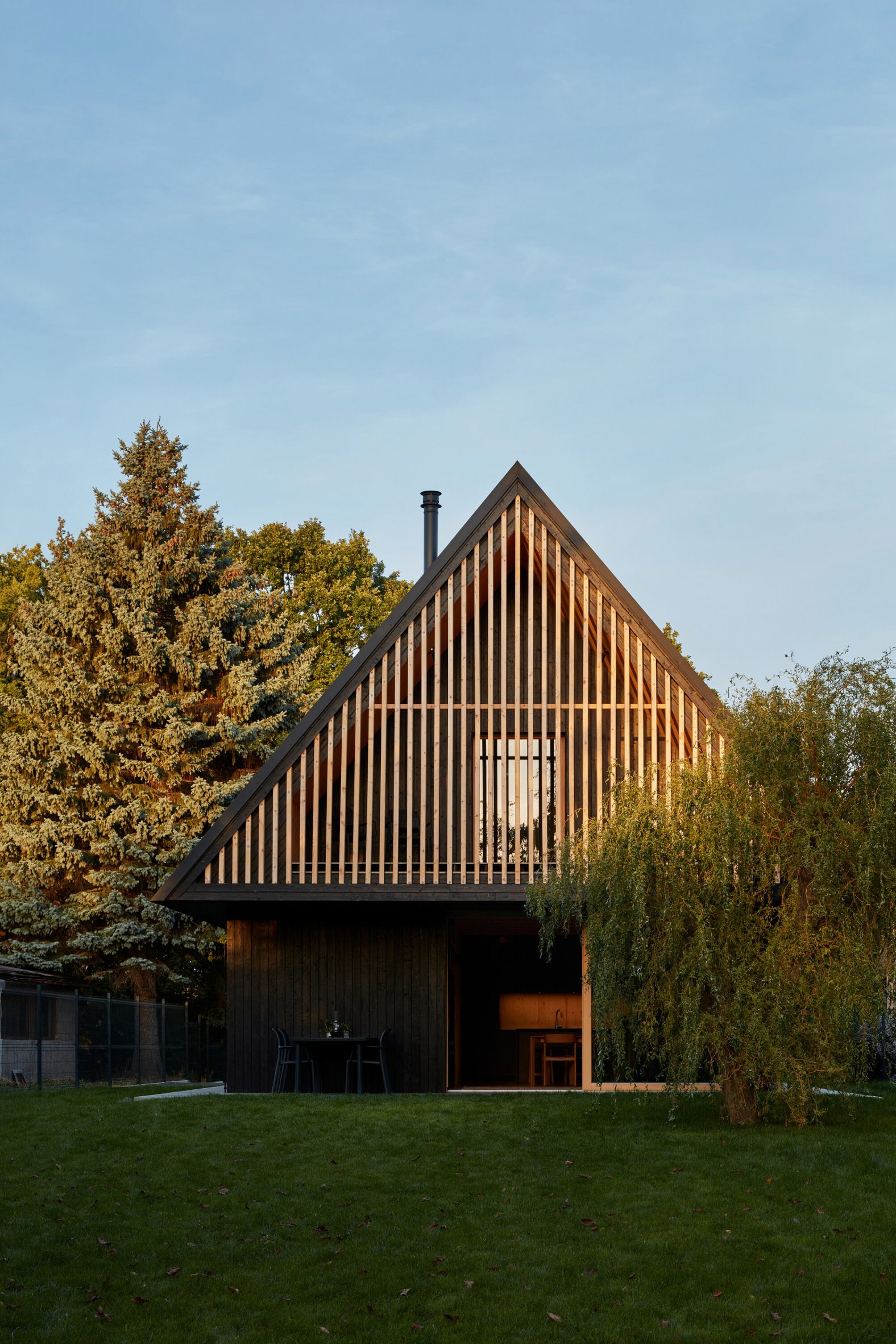 Timber clad facade of the Hut-inspired House by Atelier Hajný