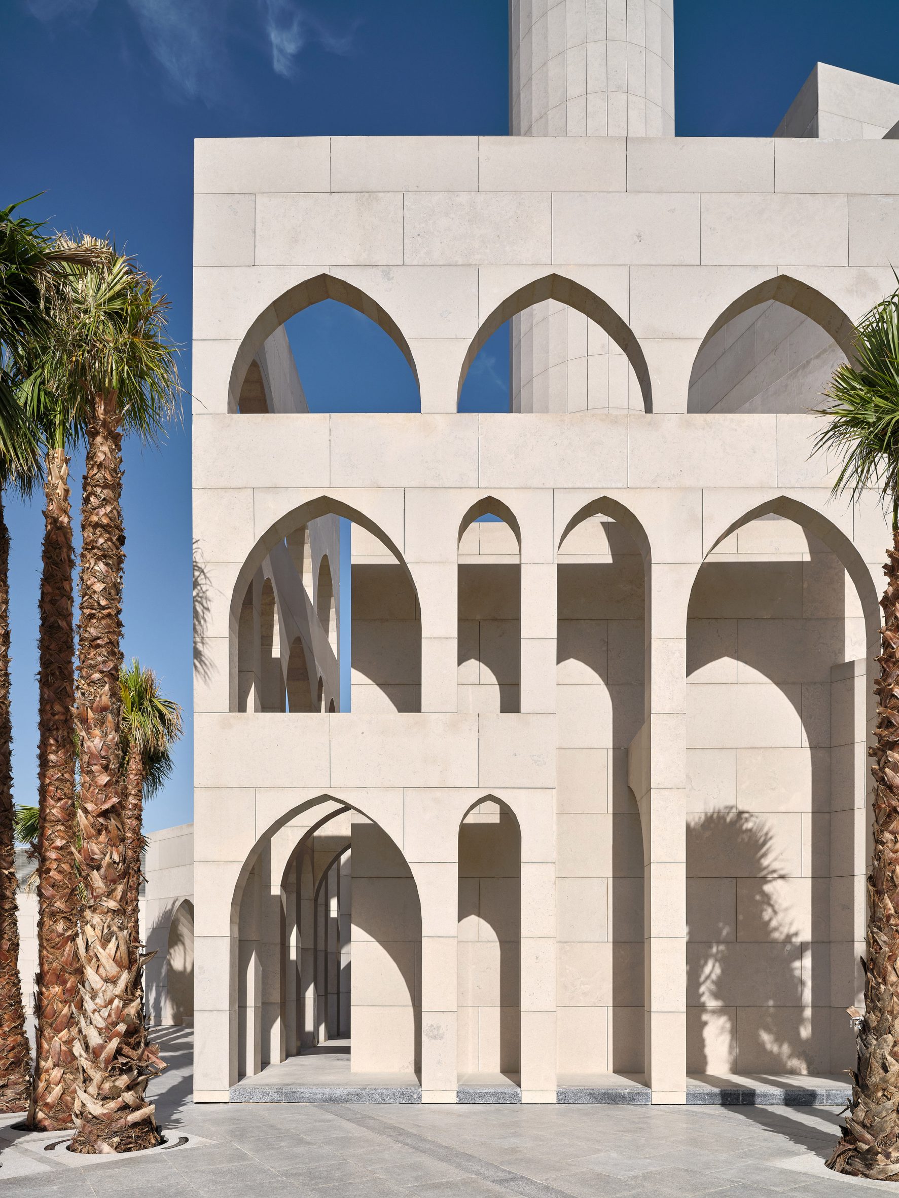 The studio used lancet arch cutouts to enrich the mosque's exteriors