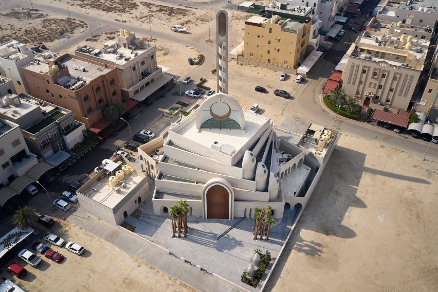 The mosque's volumes face different directions in response to the religion and urban surroundings