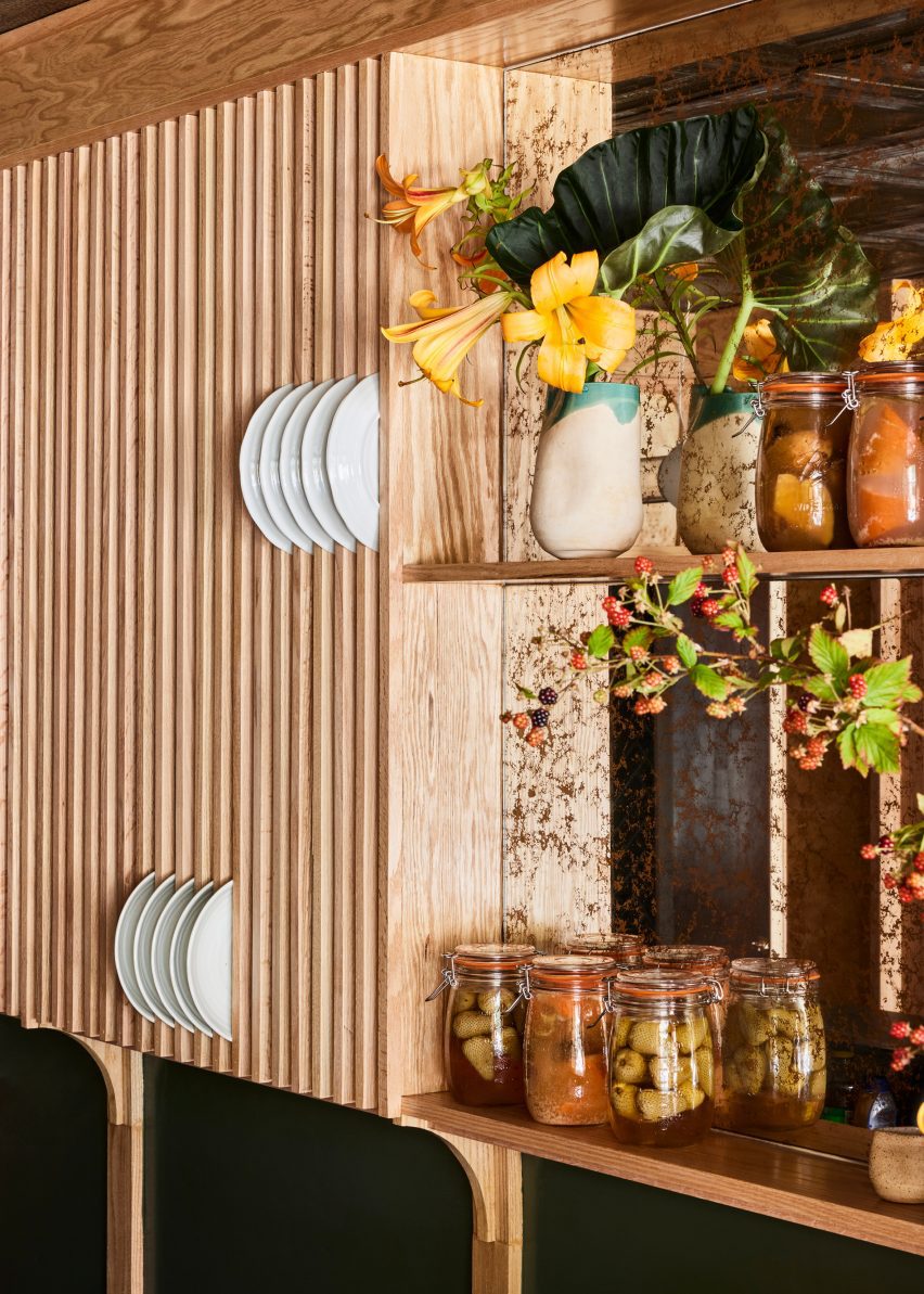 Vertical wood slats provide spaces for storing dishes