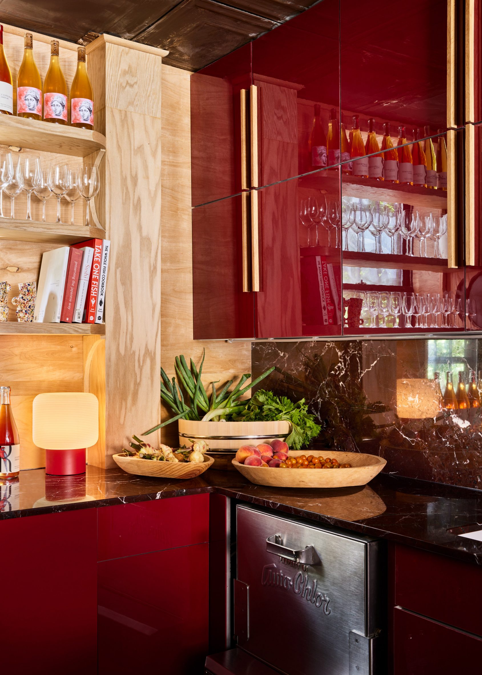 Glossy maroon kitchen cabinets