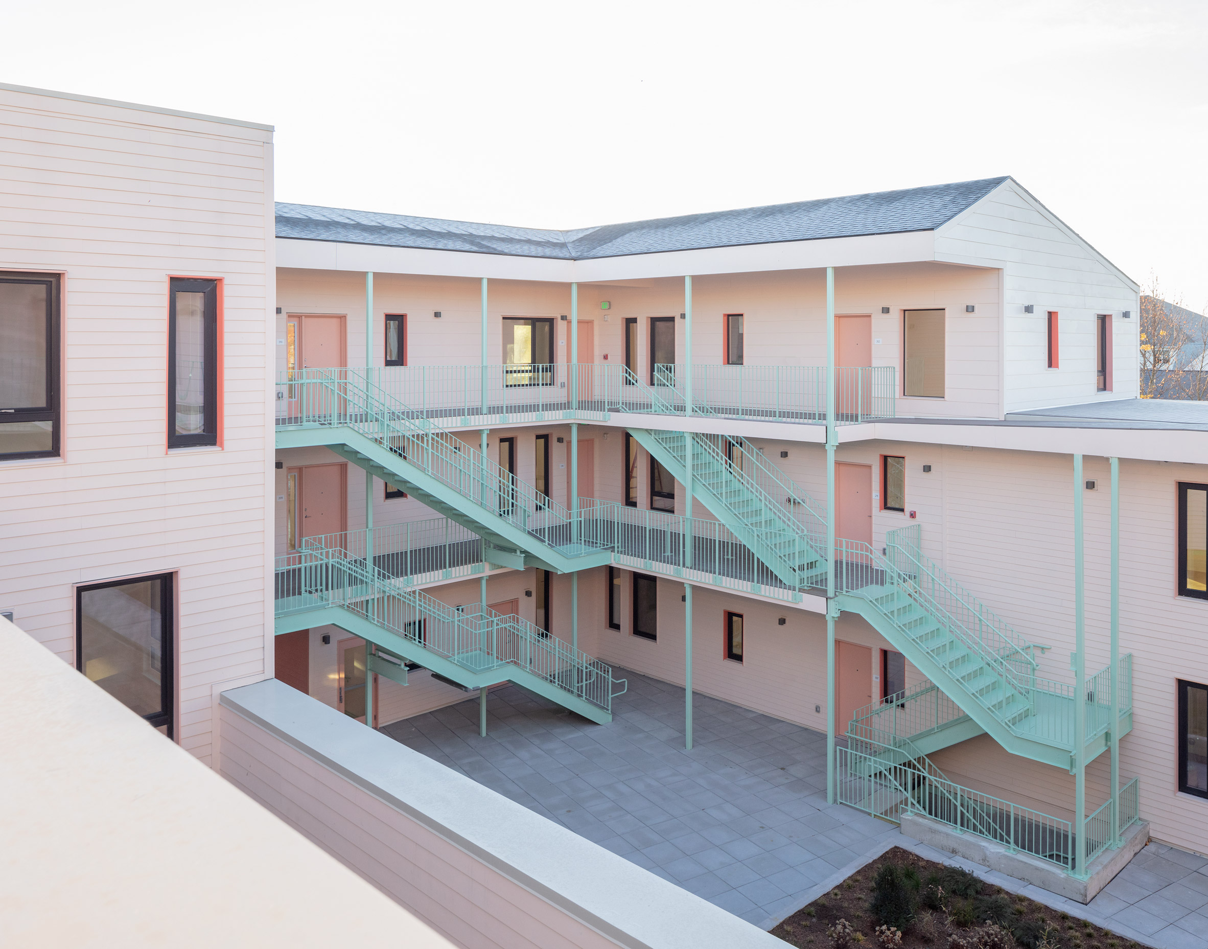 Co-housing complex with pale pink walls