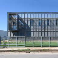 Metal screens and interior courtyards feature in Córdoba office building