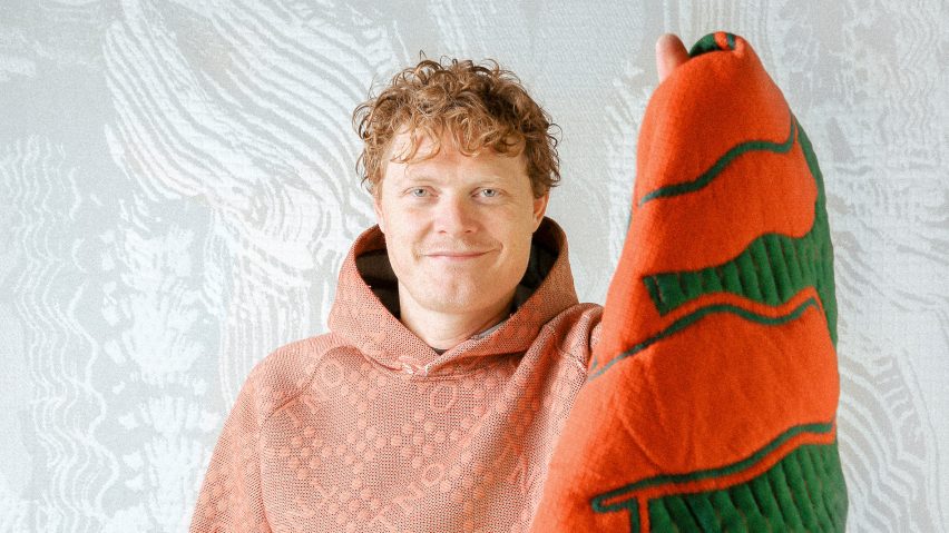 Borre Akkersdijk wearing an orange hoodie and holding a blanket