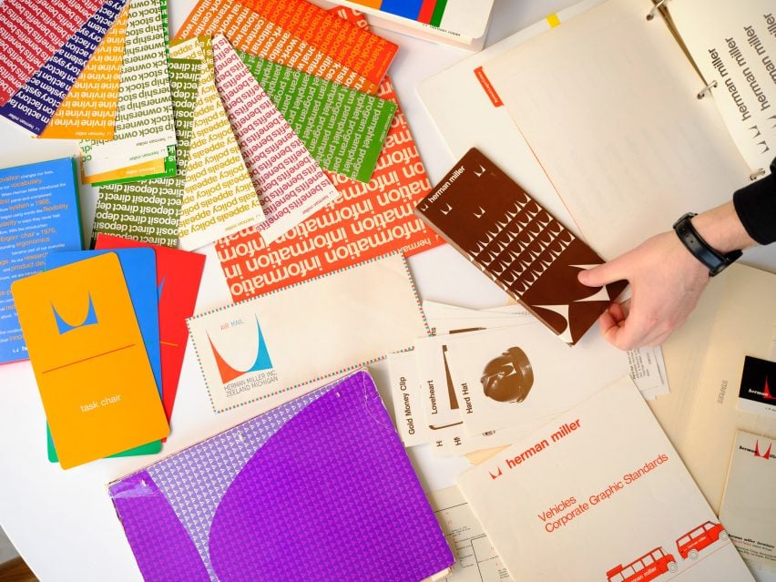 Person looking through colourful branding materials