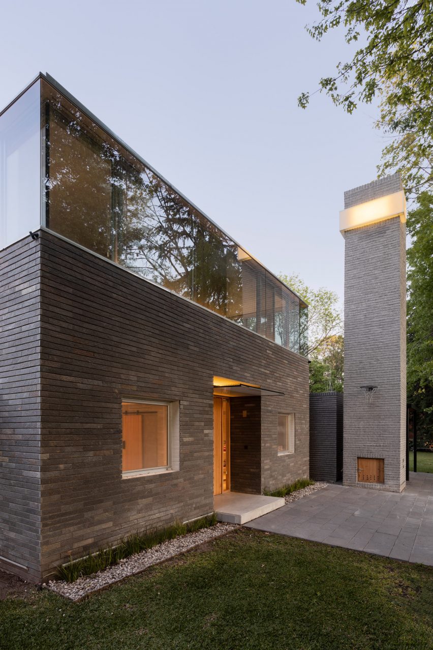 gray stone clad house and chimney