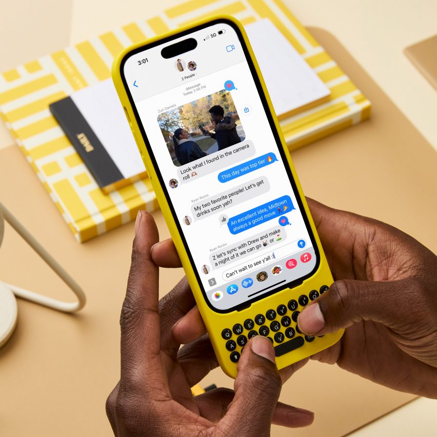 Person using iPhone with yellow keyboard by Clicks Technology