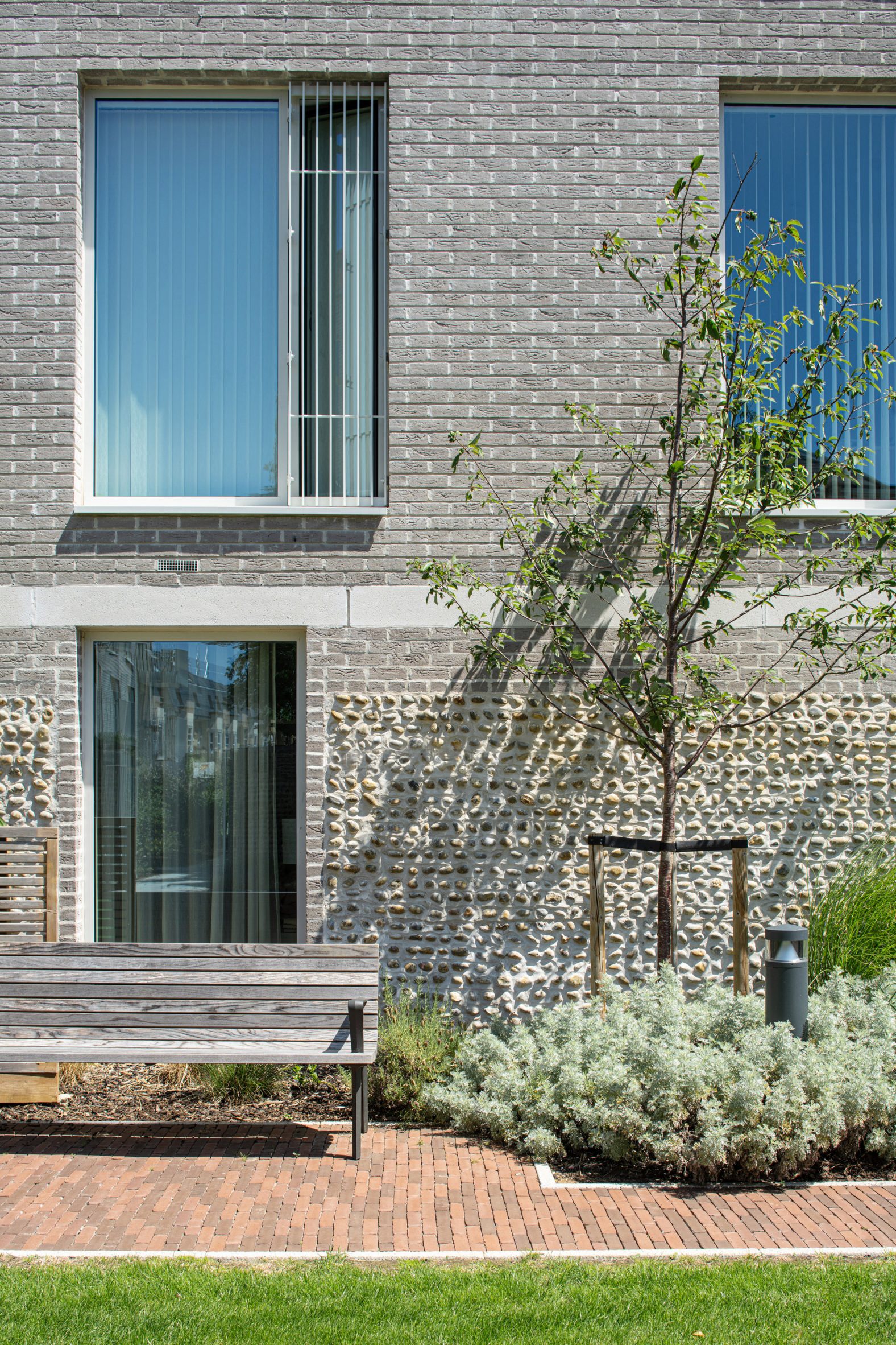 Brick and flint walls at Cobham Bowers retirement housing in Surrey by Coffey Architects