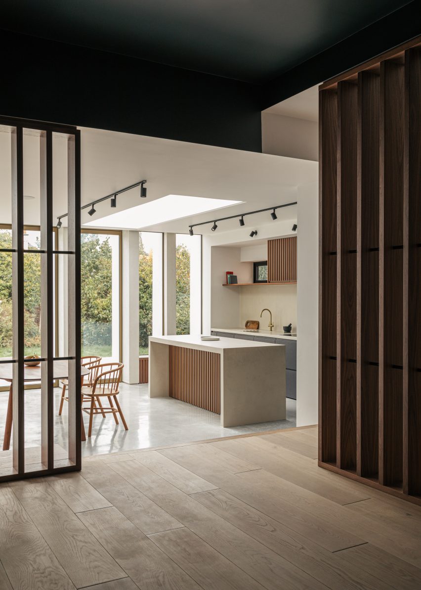 Kitchen and walnut screens in Colonnade by Will Gamble Architects in Croydon, London