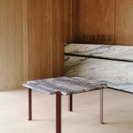 Marble table in a timber-lined interior