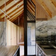 Barn-style kitchen interior with marble surfaces