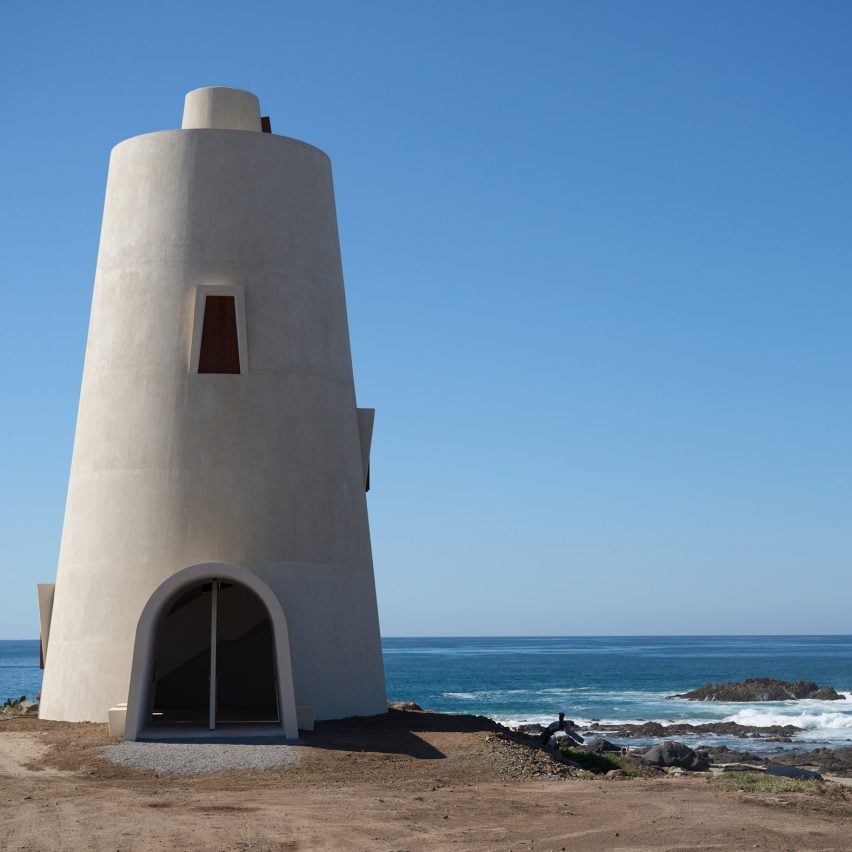 White lighthouse overlooking sea in Mexico by Gonzalo Lebrija
