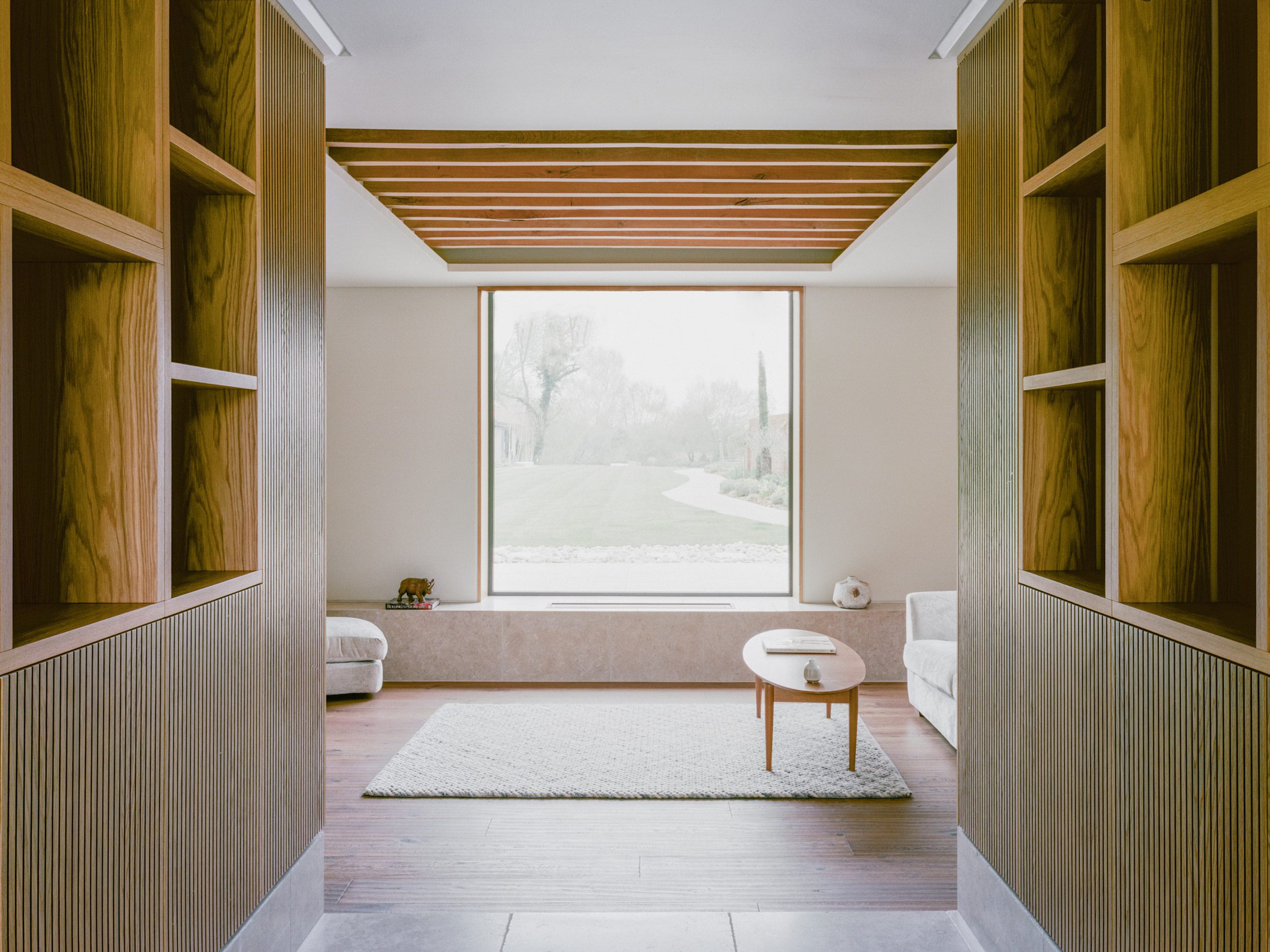 Bedroom with wooden battens inside Lowater in Marlow, UK by Fletcher Crane Architects