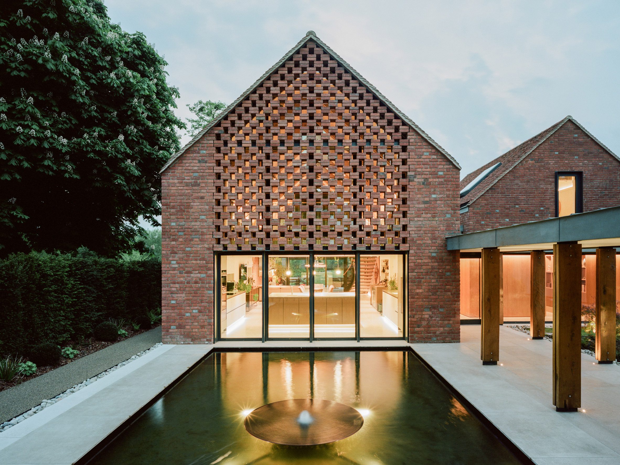 Perforated red brick facade in Lowater in Marlow, UK by Fletcher Crane Architects